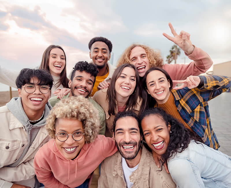 Community of people smiling and enjoying each others company
