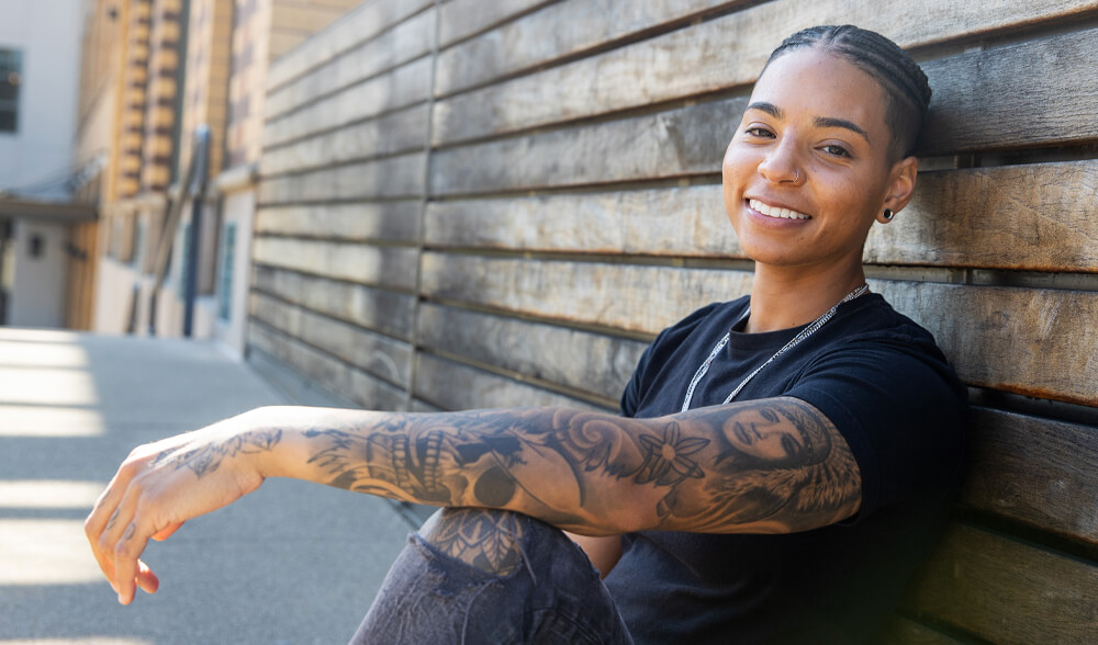 Individual Smiling and Enjoying Continued Care for the Whole Self